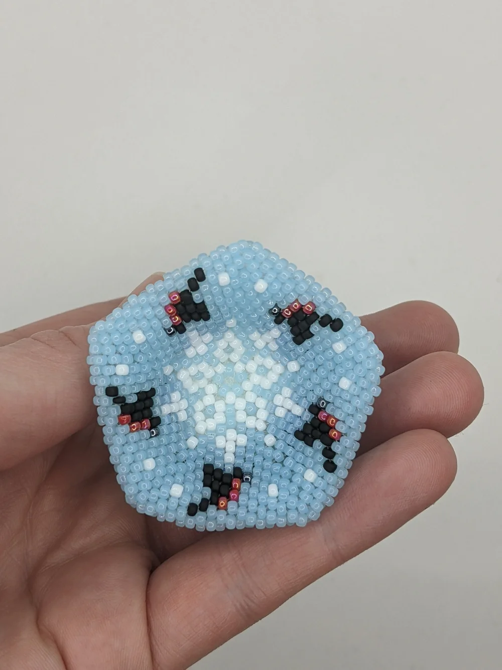Handcrafted Light Blue Beaded Bell Ornament with Floral Accents